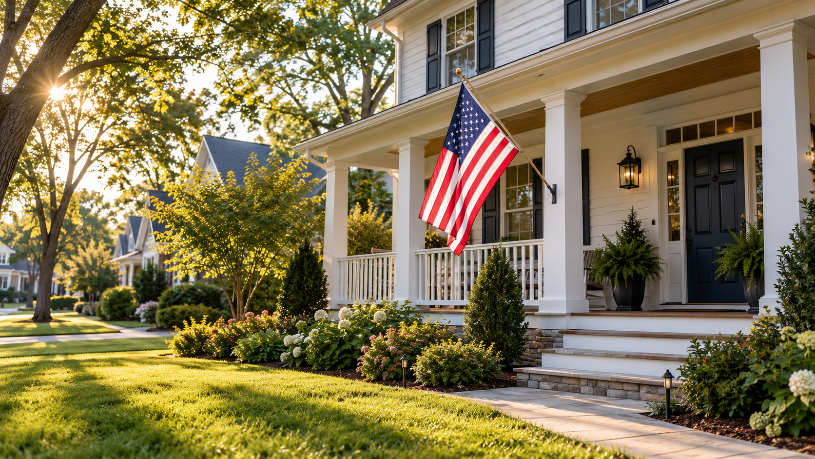 American flag on the porch of a welcoming suburban home